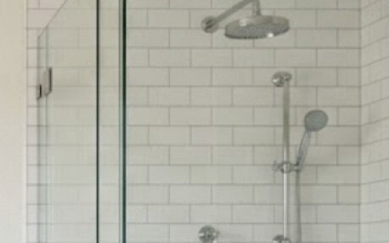 The Classic — chrome rainhead and handheld on white subway tile